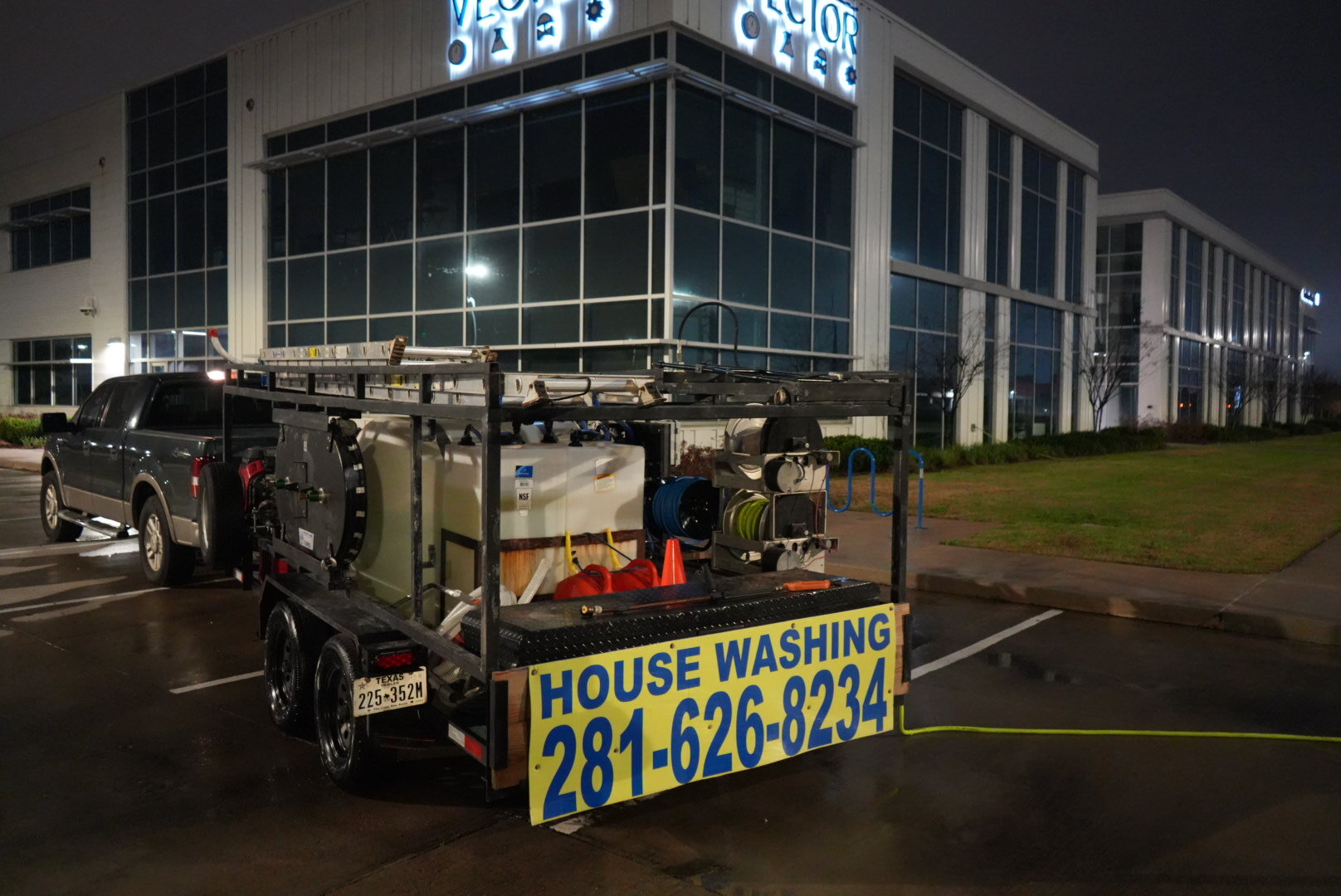 Suds Soft Wash trailer on site at a commercial property in The Woodlands, TX