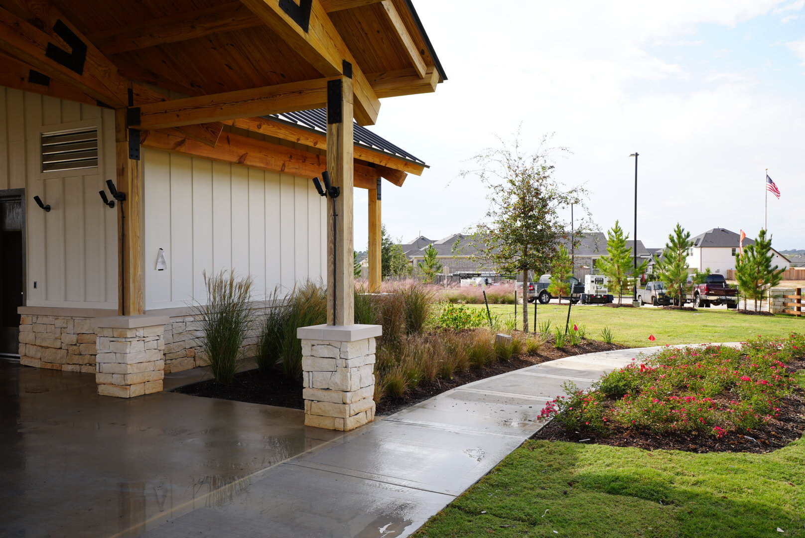 Freshly pressure-washed walkway and covered entrance at a property in The Woodlands, TX