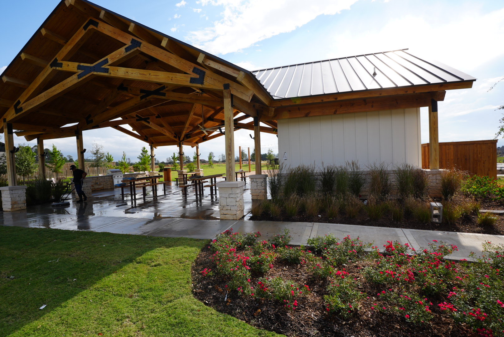 Clean outdoor pavilion and patio at a community amenity center in The Woodlands, TX