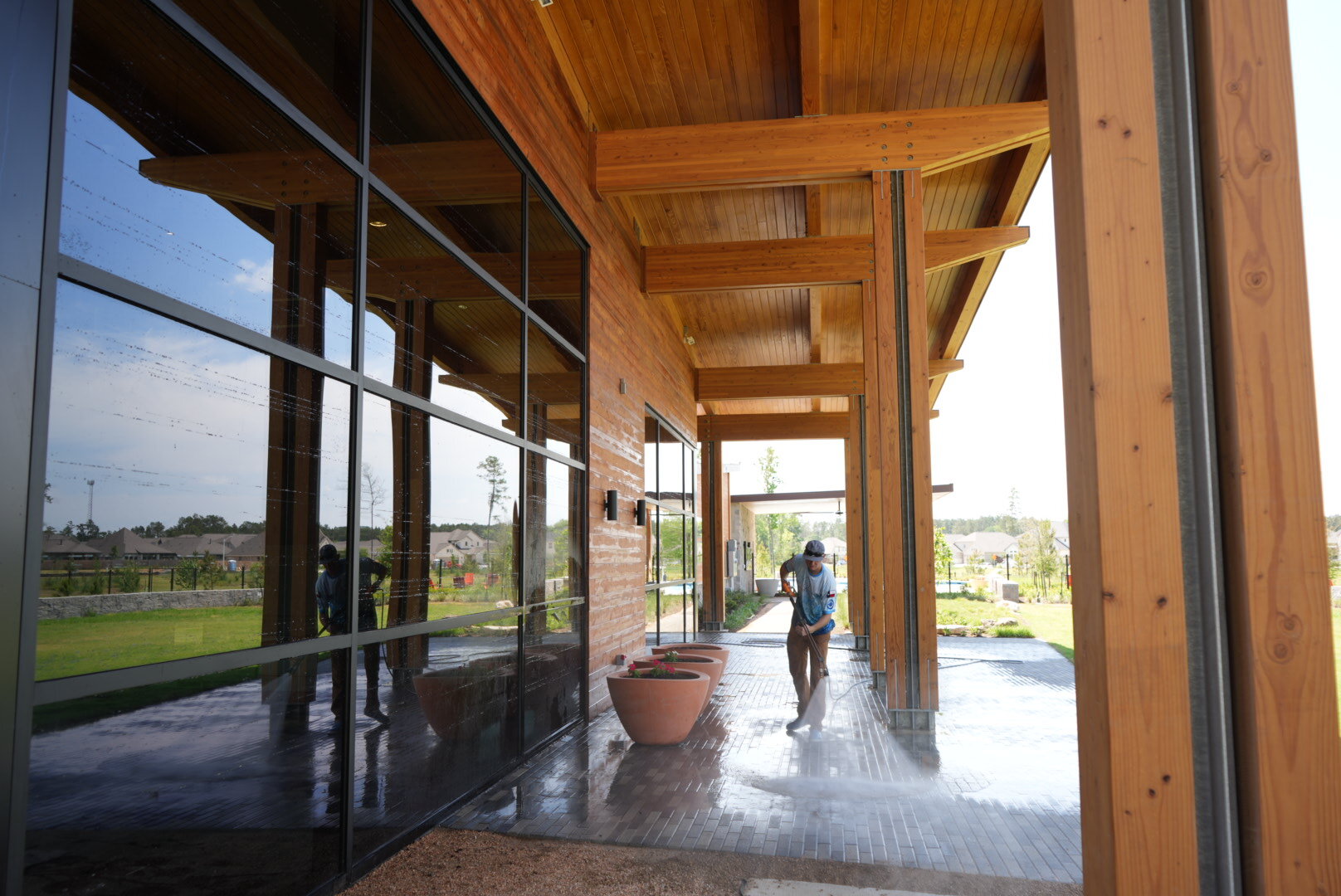Freshly cleaned covered walkway of a modern building in The Woodlands, TX