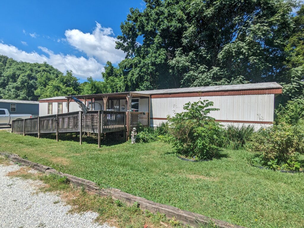 white and brown singlewide mobile home