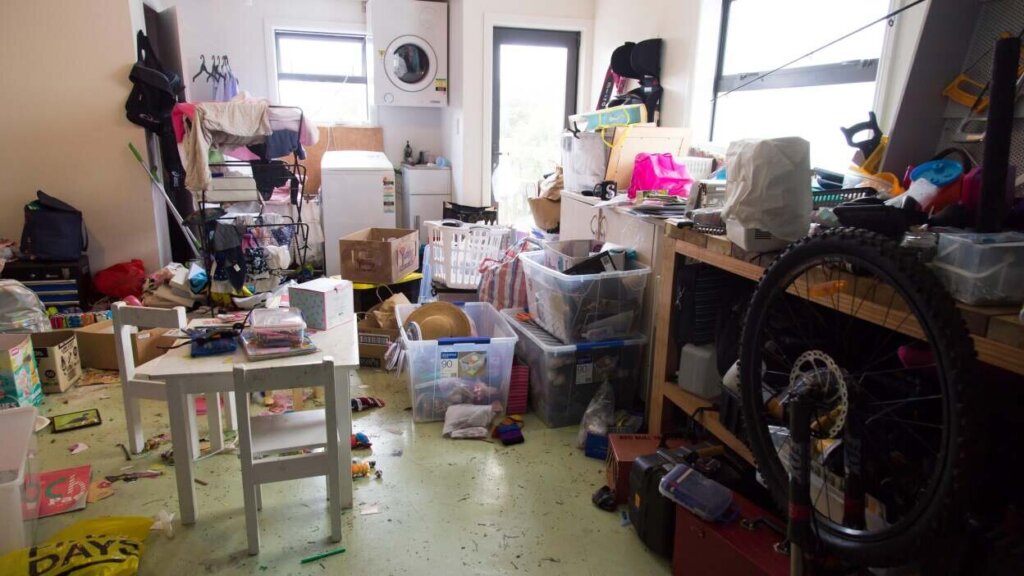 Inherited hoarder house in the Rio Grande Valley, TX with boxes and household belongings being sorted before sale