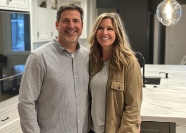 Happy couple celebrating after successfully keep their home with our help