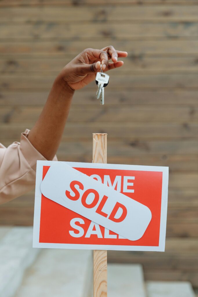 Homeowner handing over keys after selling inherited property in Georgia
