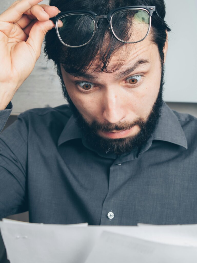 Homeowner reviewing renovation budget and realizing the costs are too high