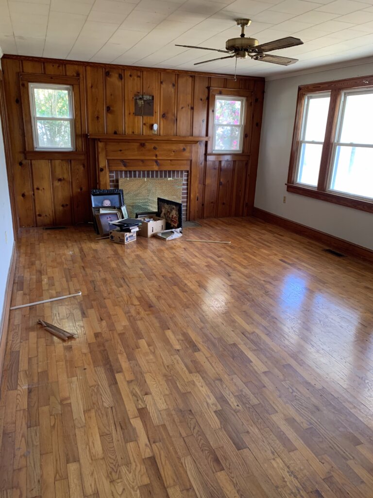 Interior of a livable but outdated home with builder-grade finishes