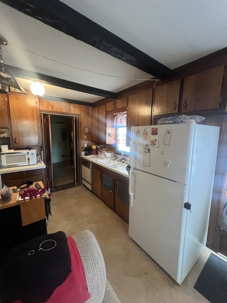 Outdated kitchen with oak cabinets and laminate countertops