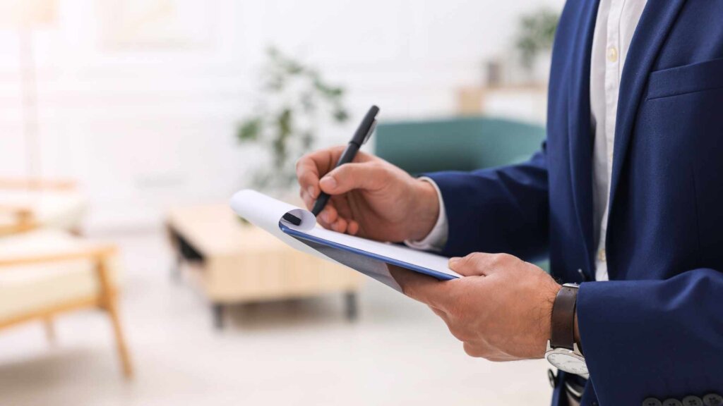 Man surveying a home for an appraisal