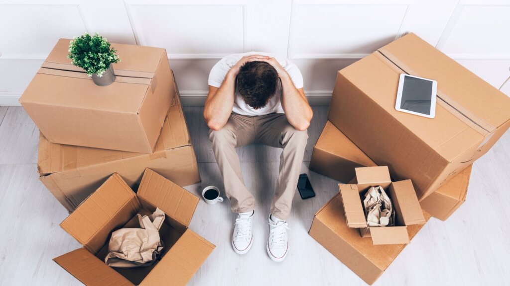 Person stressed over relocation in Rome, GA.