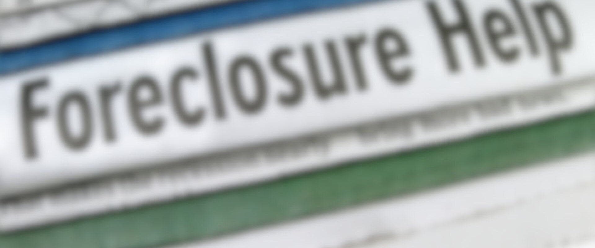 Newspaper with a headline saying "Foreclosure Help"