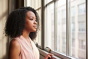 woman pondering selling before or after divorce in texas