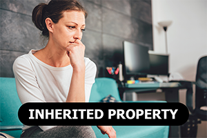 concerned woman sitting on couch thinking about selling her inherited property for cash in Lake Jackson