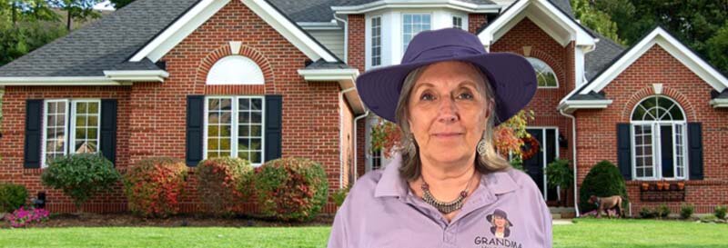 Becky Fields, the Grandma House Buyer, standing in front of a brick home in Houston Texas