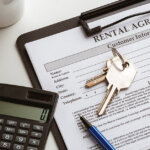 lease agreement in houston with keys calculator and coffee