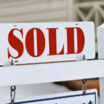 sold realtors for sale sign indicating house was sold in Houston