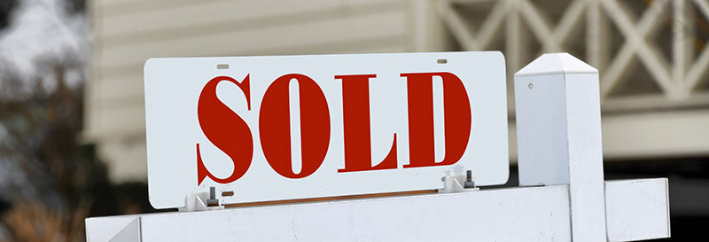 sold realtors for sale sign in houston indicating house was sold
