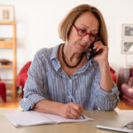 Middle age houston senior woman working at home using computer