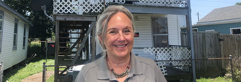 becky fields the grandma house buyer in front of a Galveston TX Duplex