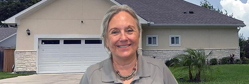 becky fields the grandma house buyer in front of a Humble TX ranch house