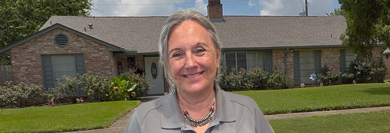 becky fields the grandma house buyer in front of a Lake Jackson TX ranch house