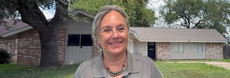 becky fields the grandma house buyer in front of a Liberty TX ranch house