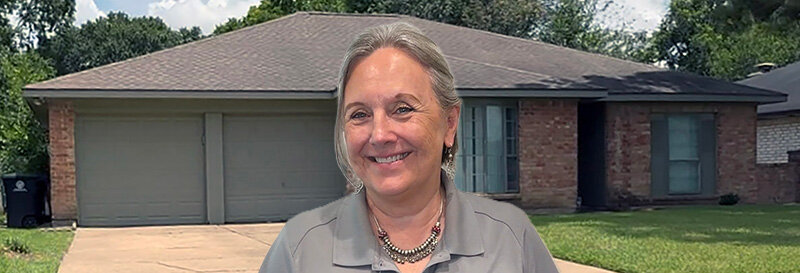 becky fields the grandma house buyer in front of a Pasadena TX ranch house