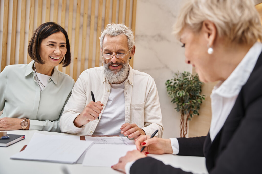 middle aged realtor signing contact