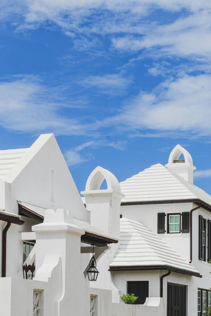 White coastal houses beneath a clear blue sky