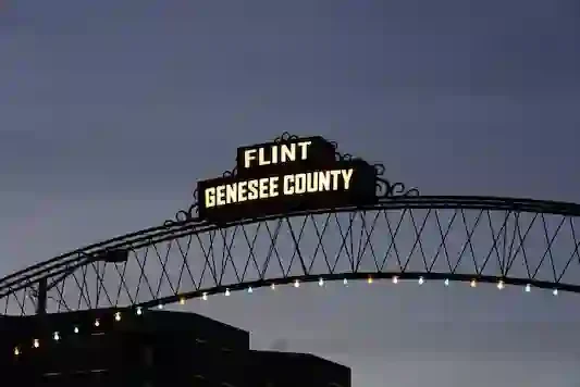 Flint Vehicle City arch bridge downtown Flint MI — Sell My House Fast Flint MI with Genesee County Home Buyers