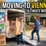 Concise, keyword-rich description for screen readers and Google Images. Couple loading a moving truck for a move to Vienna Virginia. Boxes read Kitchen Vienna and VA Bound with text We're Moving to Vienna, VA.