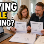 Northern Virginia homeowners reviewing sale and purchase paperwork while planning to buy a new home before selling their current one.