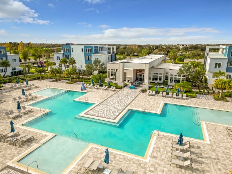 Close-up of main resort-style pool surrounded by lounge chairs at Reunion Resort