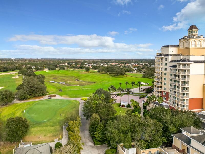 Aerial view of Reunion Resort golf course and luxury condo building in Kissimmee, Florida