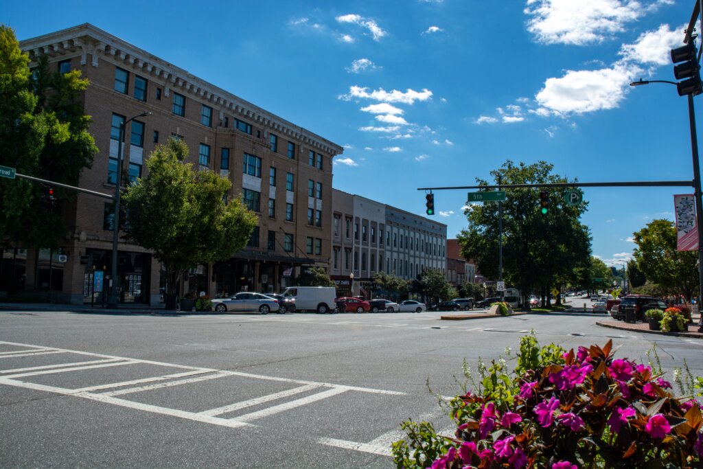 View of 5th Street in downtown Rome, GA, showcasing the vibrant energy and local businesses along the street.
