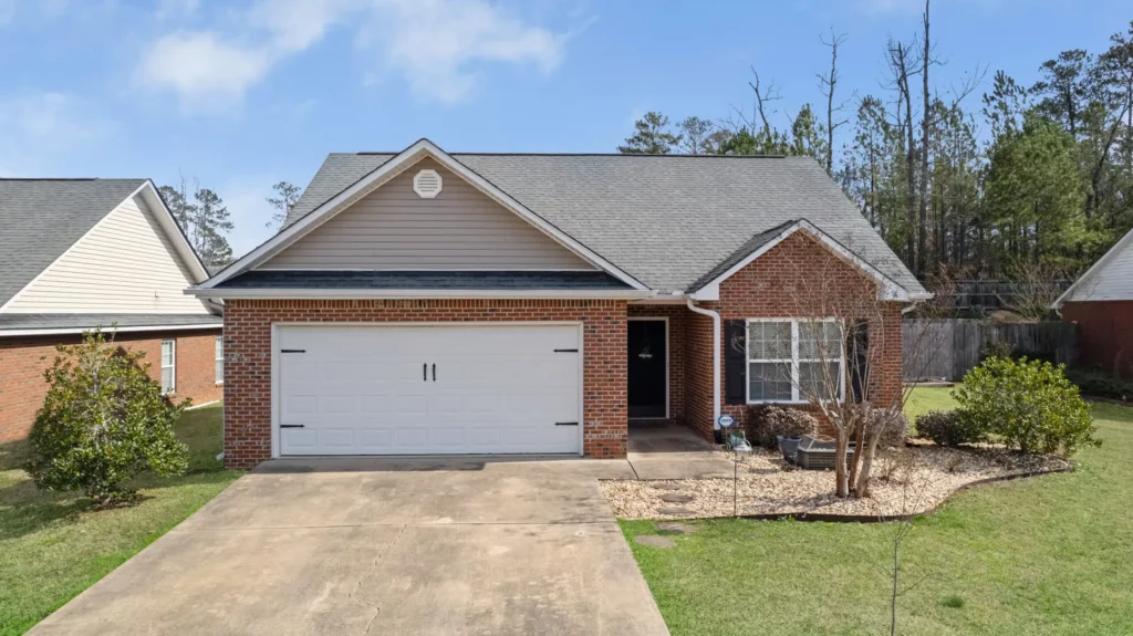 Single-family home in Rome, Georgia with brick exterior and well-kept front yard. 