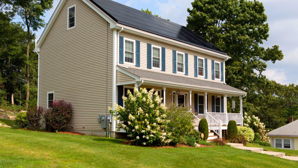 Two-story residential home with well-maintained landscaping and a welcoming front porch.