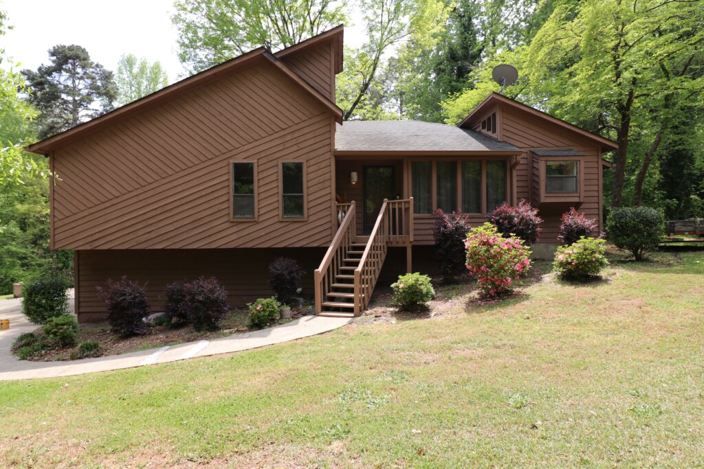 Two-story house in Dallas, Georgia with standout architectural features.