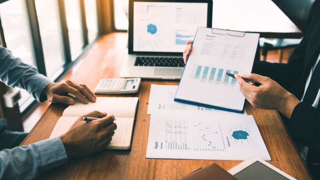 People reviewing a comparative market analysis