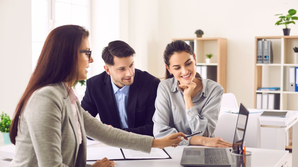 Real estate agent speaking with clients