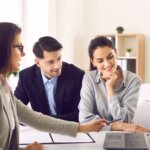 Real estate agent speaking with clients