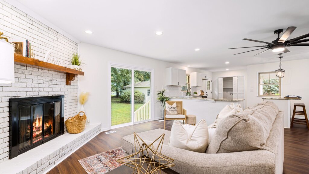 Open concept living room and kitchen that has been staged