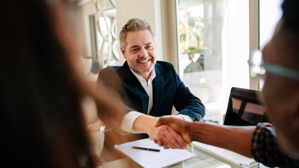 REALTOR® shaking hands with a client in Northwest Georgia