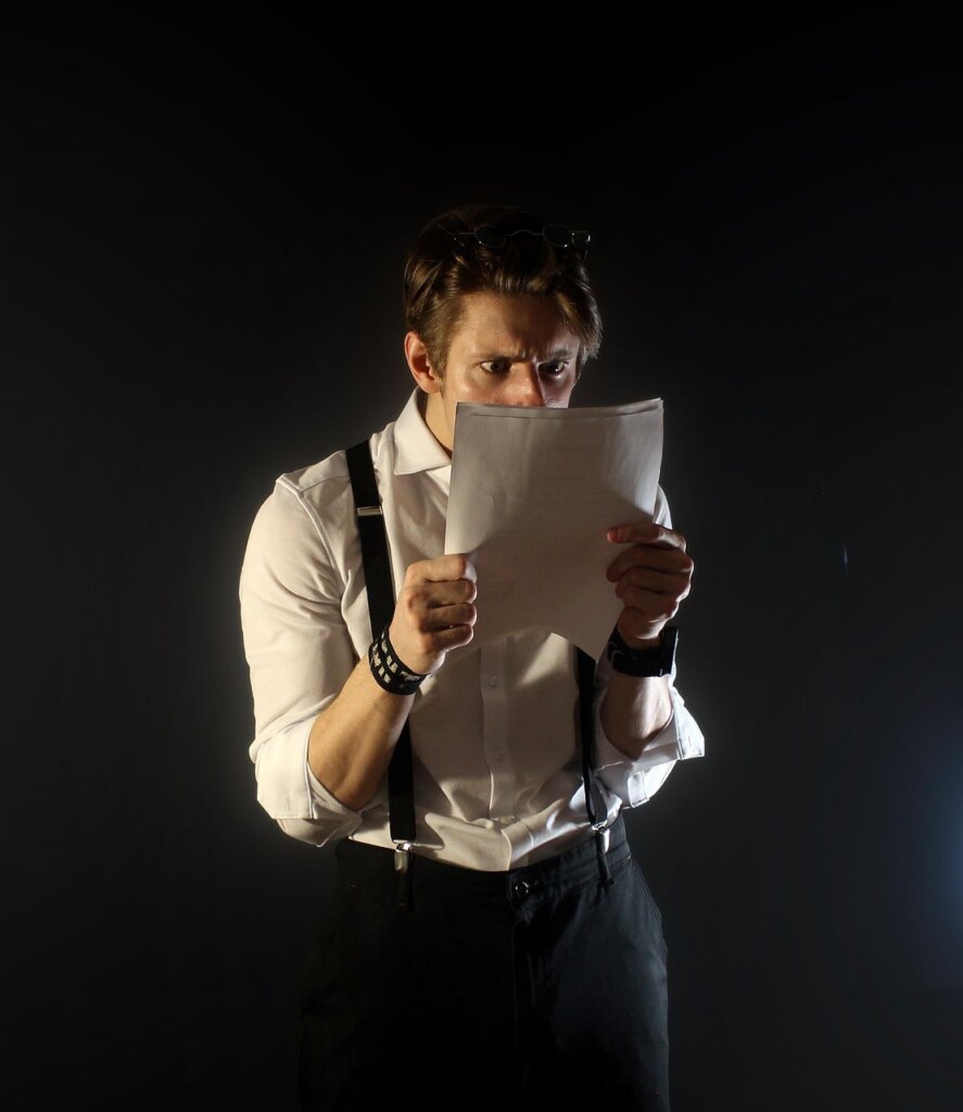 confused man looking at mortgage note allonge