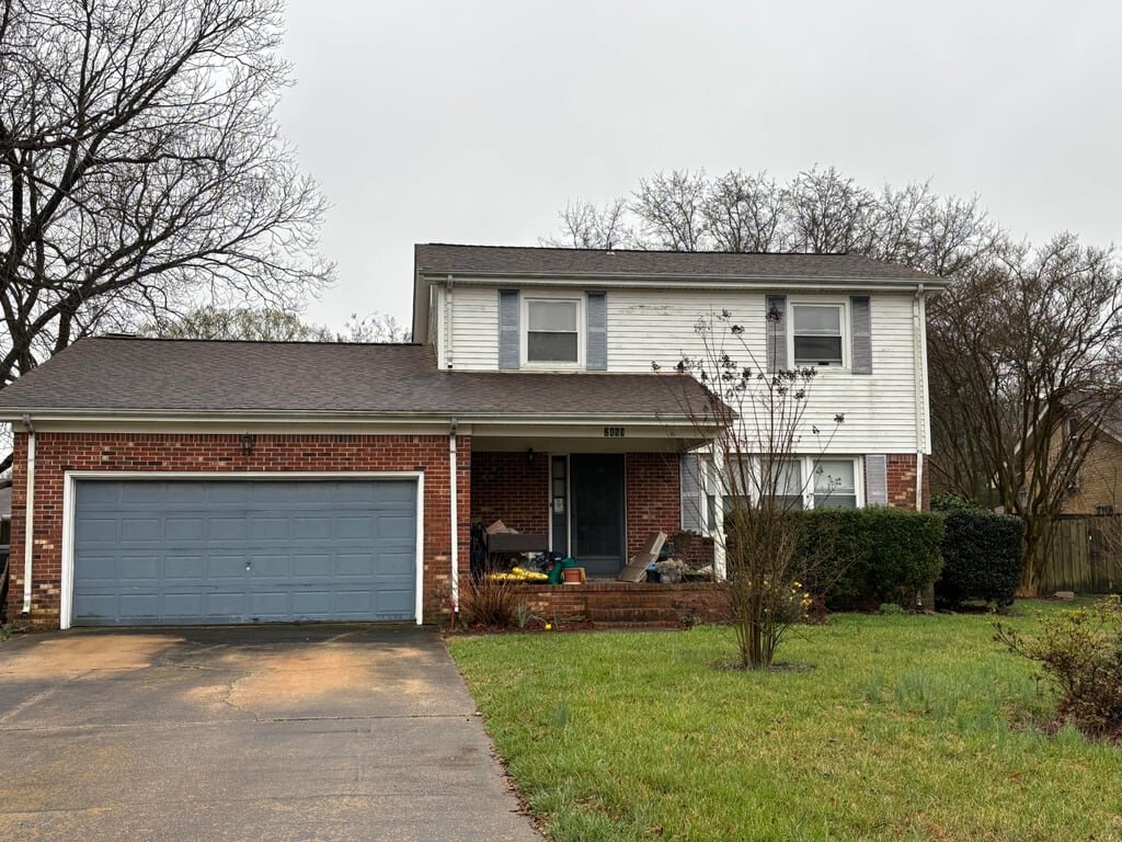 Two-story brick and siding house on Cheltenham Court in Virginia Beach that O’Neill Home Buyers bought as-is