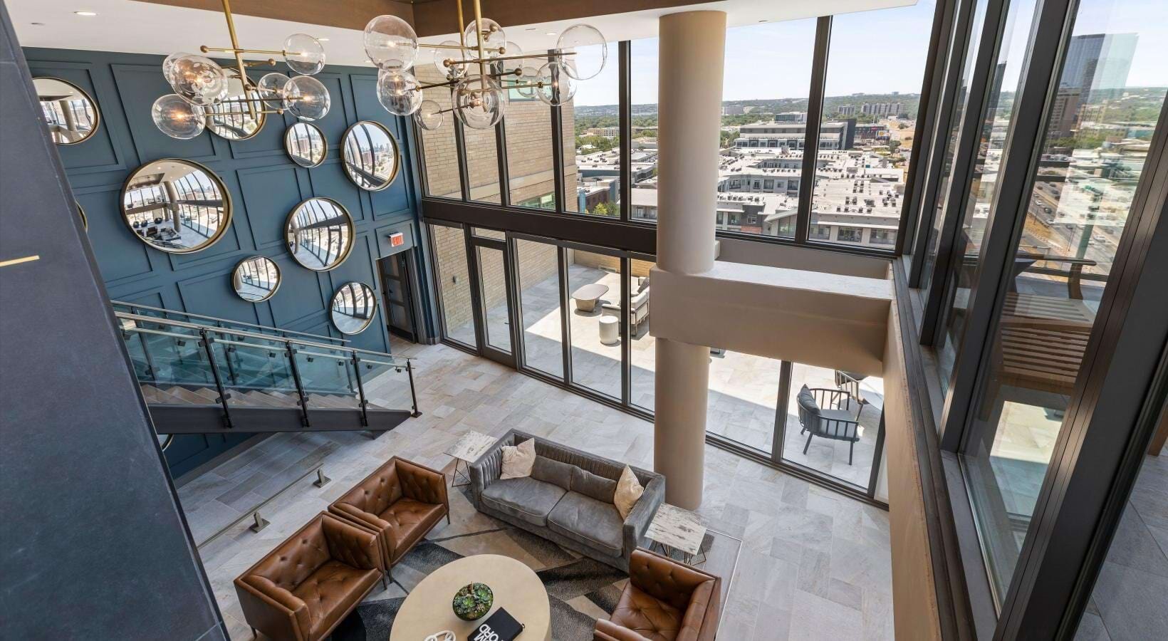 Avenir lobby — two-story atrium with skyline views