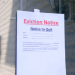 Eviction Notice to Quit taped to a window in Florida, illustrating the legal first step landlords must take to evict a tenant without a lease in 2025.