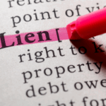 Definition of lien highlighted with a pink marker in a legal dictionary.
