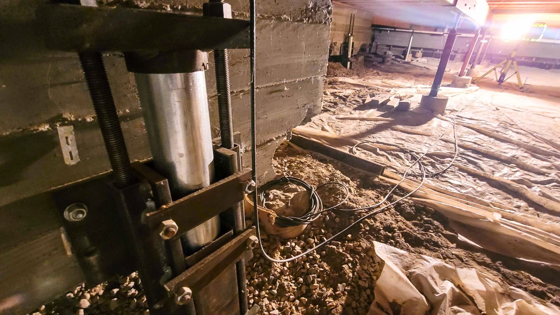 Jacking a foundation to make it level in Boston, MA.