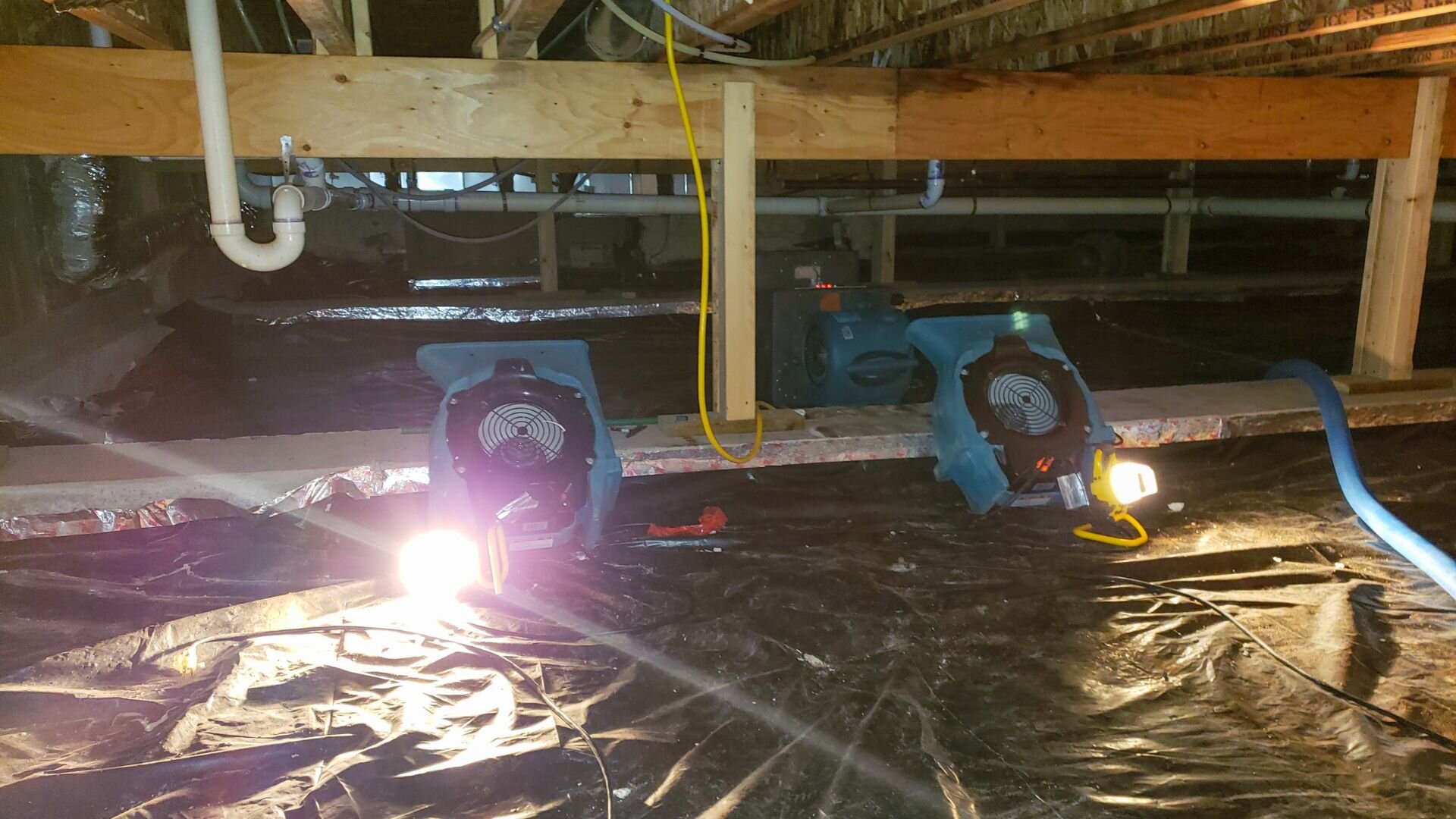 Crawl space with dehumidifiers in Boston, MA.