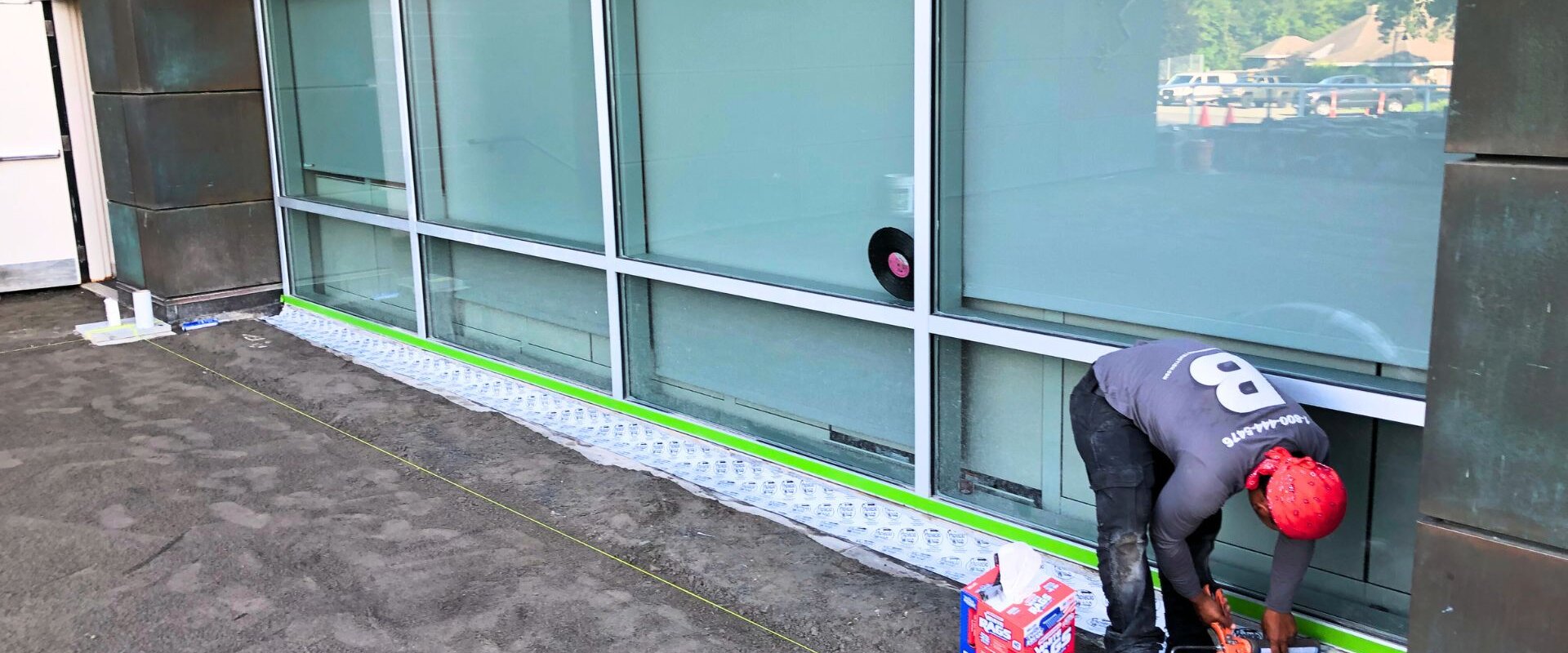 Contractor waterproofing foundation for a business in Boston, MA.